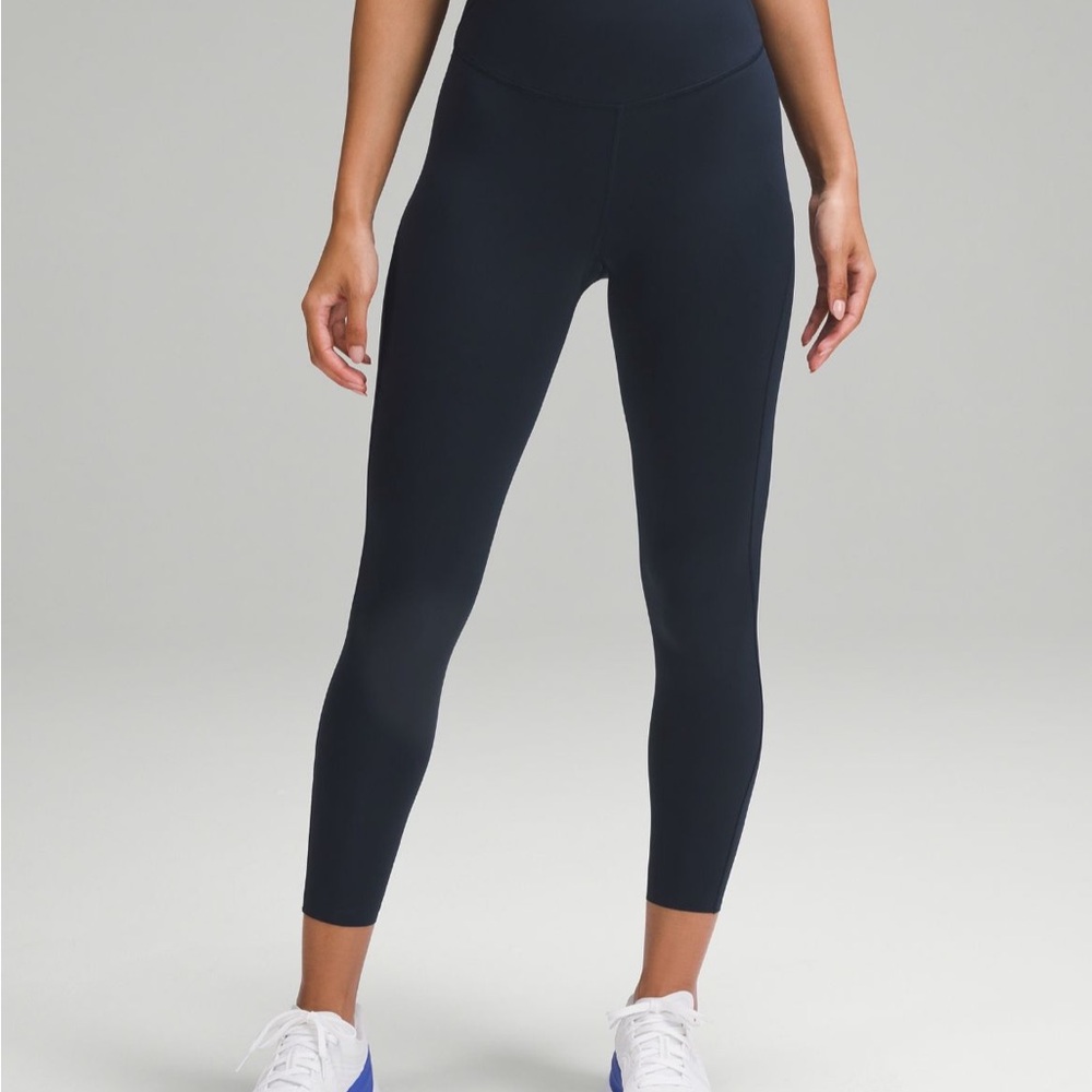 Base pace high rise tight true navy 25’